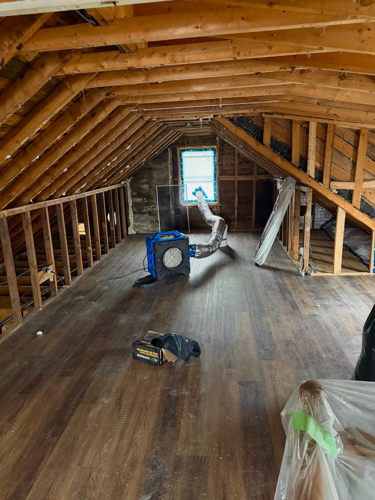 Attic stripped to the rafters with an air scrubber running