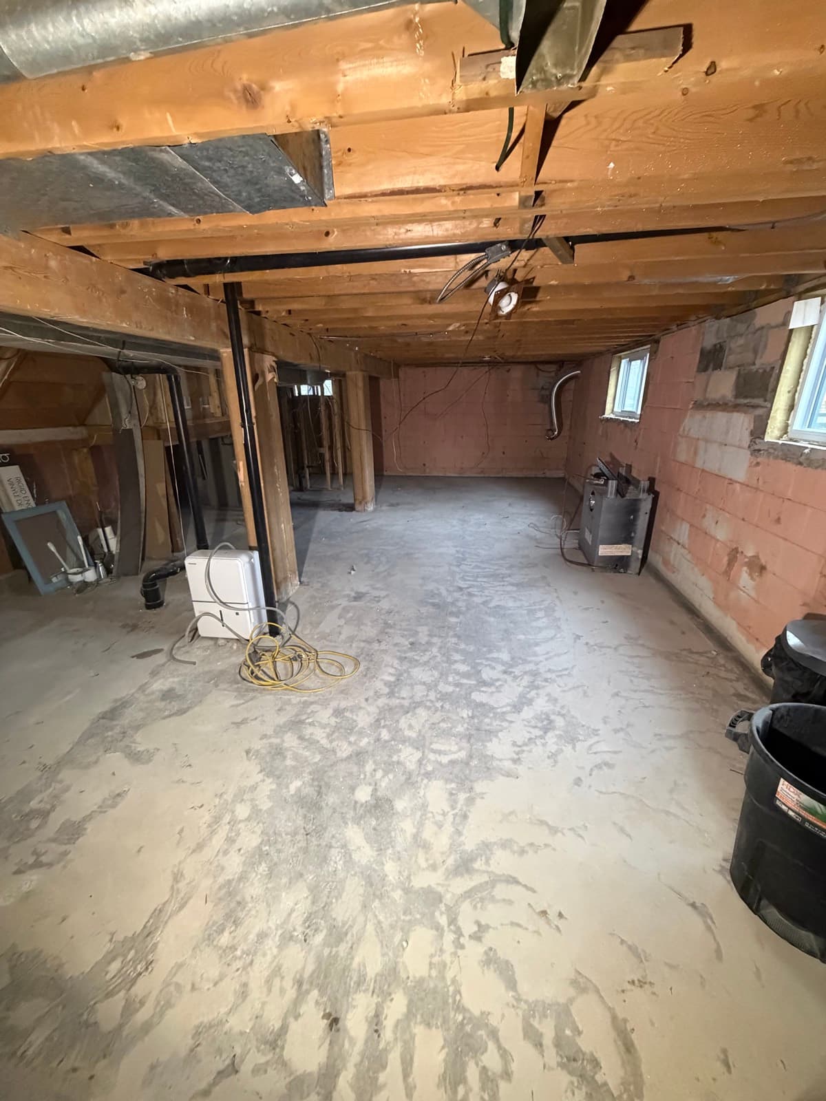 Basement stripped to joists and block walls ahead of renovation