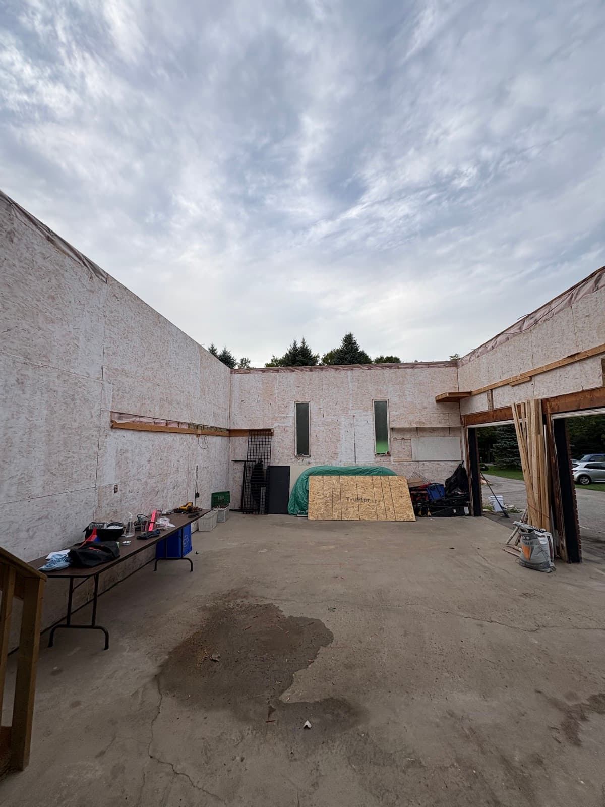 Garage with walls opened up on an active teardown site
